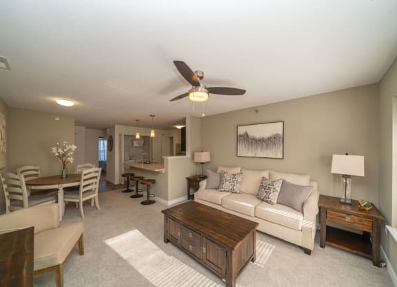 Living Room and Kitchen Breakfast Bar at Strathmore Apartment Homes, West Des Moines
