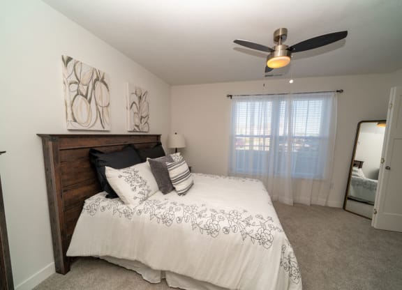 Beautiful Bright Bedroom With Wide Windows at Strathmore Apartment Homes, West Des Moines, Iowa