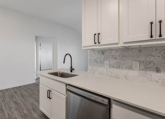 A kitchen with a white sink and cabinets. at Sundance Apartments, Indianapolis, 46237