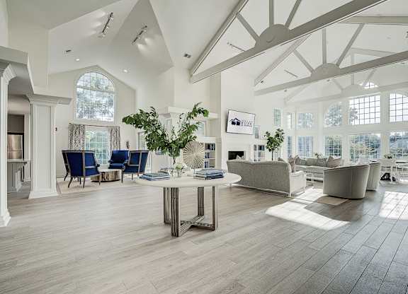 A spacious living room with a large table and chairs. at Sunscape Apartments, Roanoke, VA, 24018