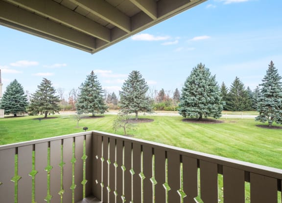 a view of the park-like grounds from the balcony of a house at Tanglewood Apartments, Oak Creek, Wisconsin