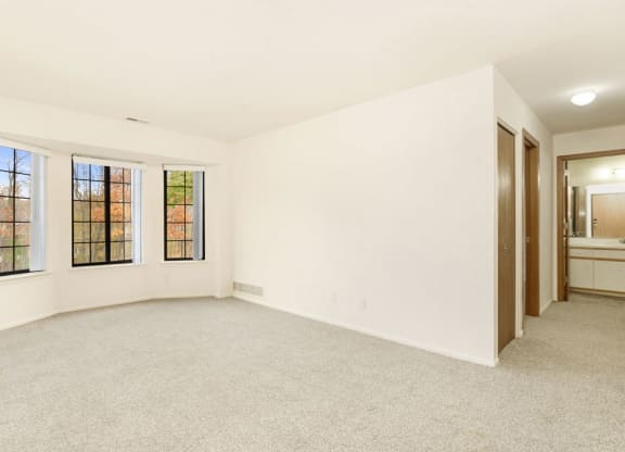 Spacious Living Room with Bay Window at Tanglewood Apartments, Oak Creek