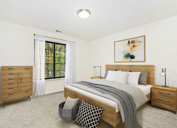 A spacious bedroom with a large bed and a window at Tanglewood Apartments, Oak Creek