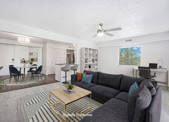 enlarged living room with a couch and coffee table at The Crossings Apartments, Michigan, 49508