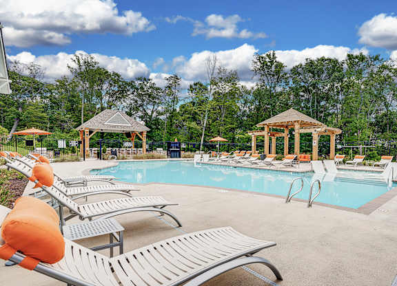 A pool with sun loungers and a gazebo at The Retreat Apartments, Roanoke, 24019
