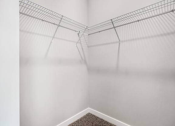A wire shelf is mounted on a white wall at The Retreat Apartments, Roanoke, 24019