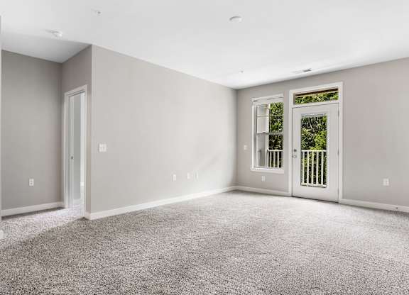 A room with grey carpet and white walls at The Retreat Apartments, Roanoke, 24019