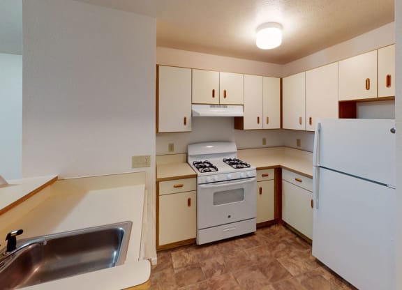 two bedroom kitchen with white appliances  at Tracy Creek Apartment Homes, Perrysburg, Ohio