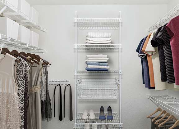 Walk in closet with wardrobe organizers at Tracy Creek Apartment Homes in Perrysburg, OH