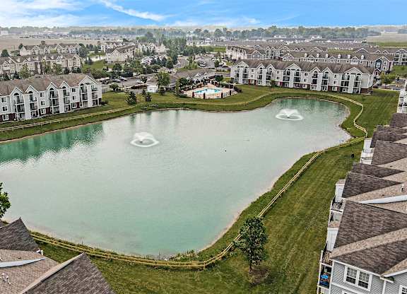 A large pond in the middle of an apartment community at Tracy Creek Apartments, Perrysburg