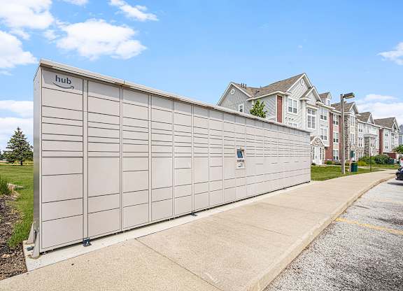 Amazon Hub branded mailbox is on the sidewalk at Tracy Creek Apartments, Perrysburg