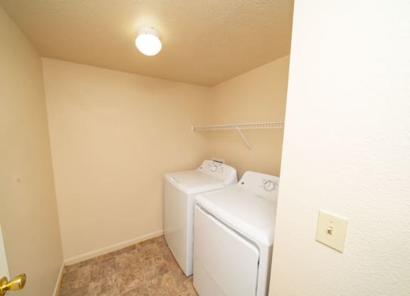 Separate Laundry Room at Trillium Pointe Apartment Homes in Jackson, MI