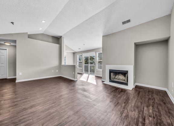 the living room has a fireplace and hardwood floors at Trophy Club at Bellgrade, Midlothian, VA, 23113