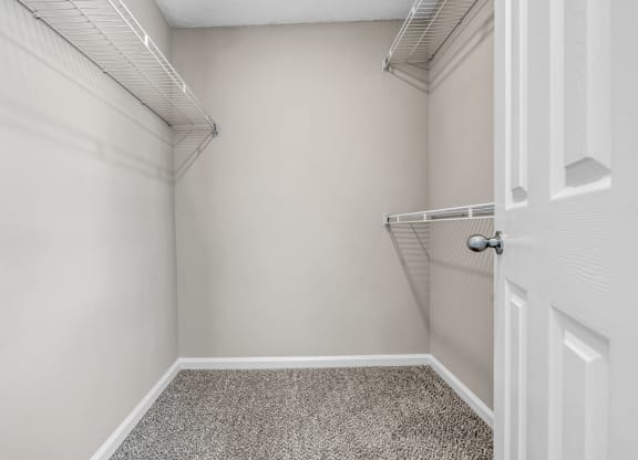 an empty closet in a home with a white door at Trophy Club at Bellgrade, Midlothian, VA, 23113