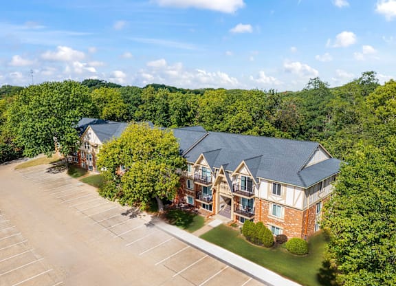 A large building with a parking lot in front of it at Timberlane Apartments, Illinois, 61615