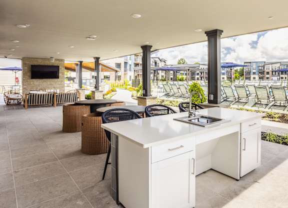 Open clubhouse kitchen with sitting are and TV at Upper Vue Flats, Dublin, OH, Ohio