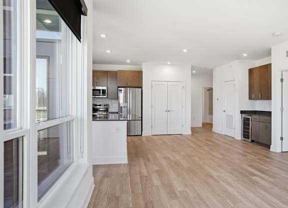 A modern kitchen with wooden floors and white walls at Upper Vue Flats, Dublin