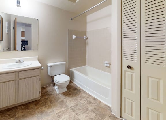 a bathroom with a linen closet at Walnut Trail Apartments in Portage, MI 49002