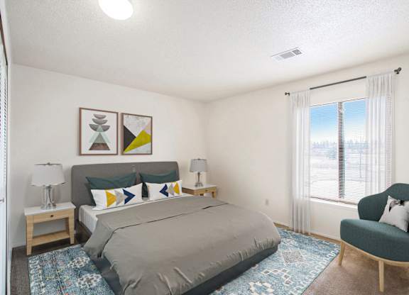 A spacious bedroom with a large bed, window and a chair at Walnut Trail Apartments, Portage, MI, 49002