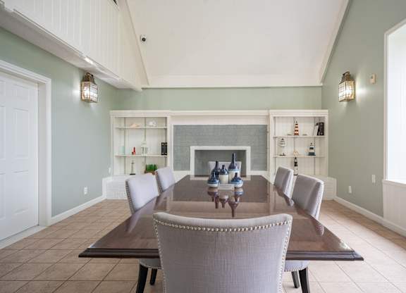 A dining room with a table and chairs at WaterFront Apartments, Virginia Beach, 23453