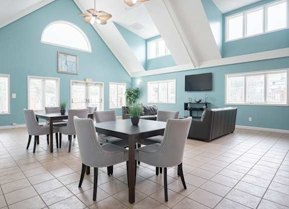 A dining room with a table and chairs at WaterFront Apartments, Virginia Beach, 23453