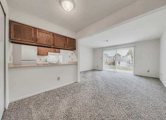 A room with a grey carpet and white walls at WaterFront Apartments, Virginia Beach, 23453