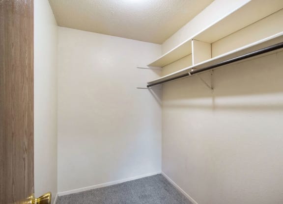large closet with shelving at West Wind Apartments in Fort Wayne, IN