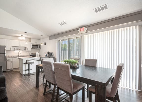 Renovated kitchen with dining area at West Wind Apartments, Fort Wayne, IN