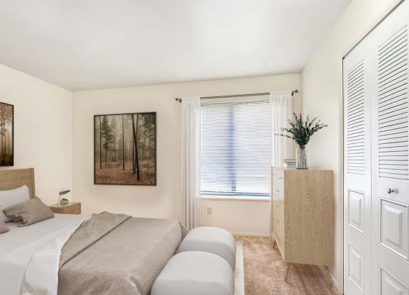 A bedroom with a bed, a nightstand, a cabinet, and a painting on the wall at West Wind Apartments, Fort Wayne, 46808