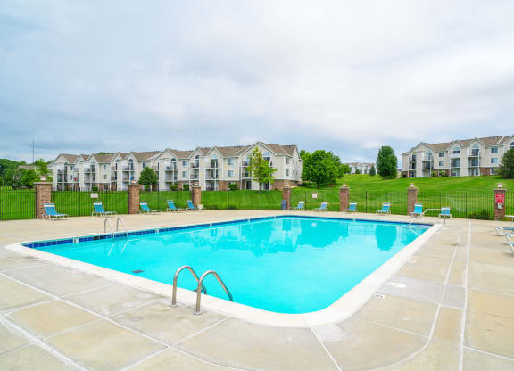 Outdoor Pool with Lounge Chairs at West Hampton Park Apartment Homes, Elkhorn, 68022