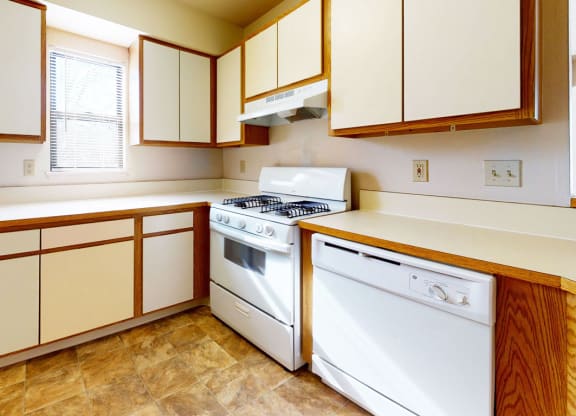 a kitchen with a window at Windmill Lakes Apartments, Holland, 49424