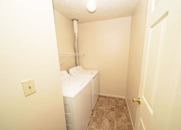 laundry room with a washer and dryer at Windmill Lakes Apartments, Holland, 49424