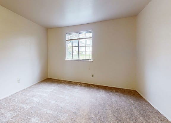 spacious bedroom with plush carpeting  at Wood Creek Apartments, Wisconsin