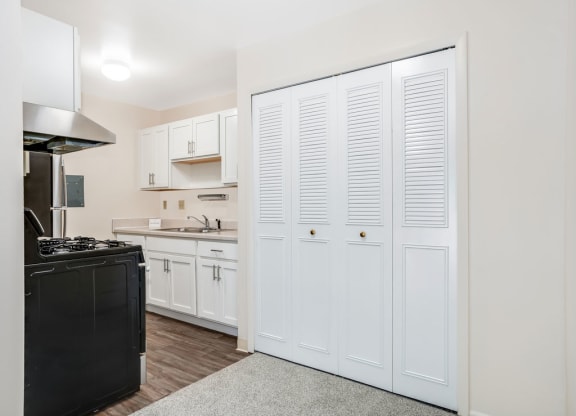Kitchen with Stainless Steel Appliances Private Balcony at Wood Creek Apartments in Kenosha, WI