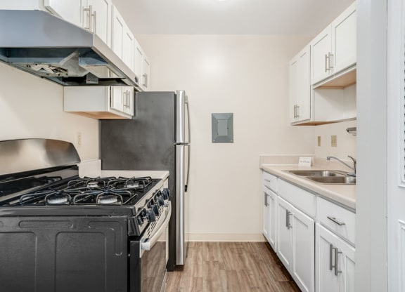 White Shaker-Style Cabinetry Private Balcony at Wood Creek Apartments in Kenosha, WI