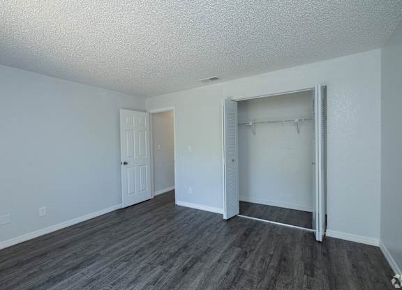 A room with a grey floor and white walls.