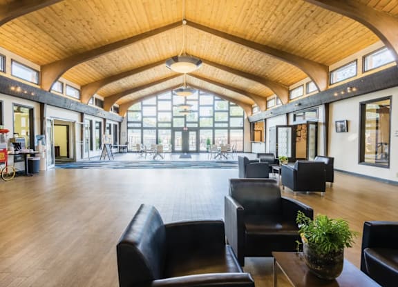A large room with a high ceiling and wooden floors.