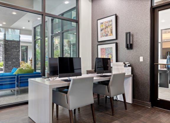 a home office with two computers and a printer on a desk at Pearce at Pavilion Luxury Apartments, Riverview, FL, Florida, 33578