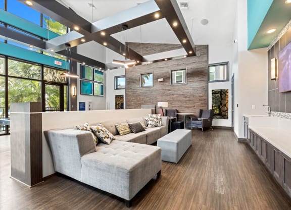 a large living room with couches and a tv at Pearce at Pavilion Luxury Apartments, Riverview