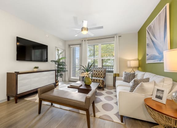 a living room with a couch and a coffee table at Pearce at Pavilion Luxury Apartments, Riverview, FL, Florida, 33578