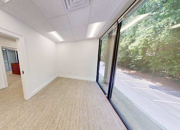 A room with a view of the street outside.