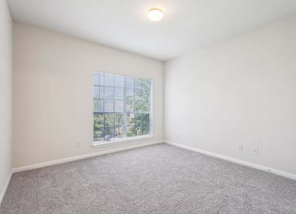 A big bedroom with a window
