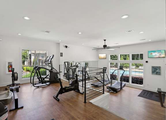 A spacious gym with a variety of exercise equipment.
