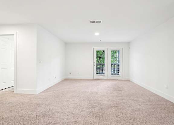 Living room with carpet and window