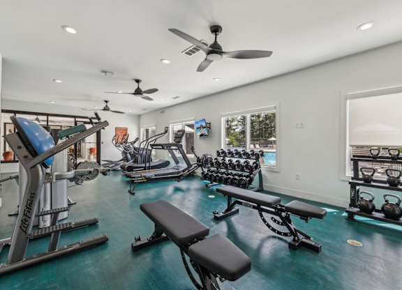 A well-equipped home gym with a variety of exercise equipment.