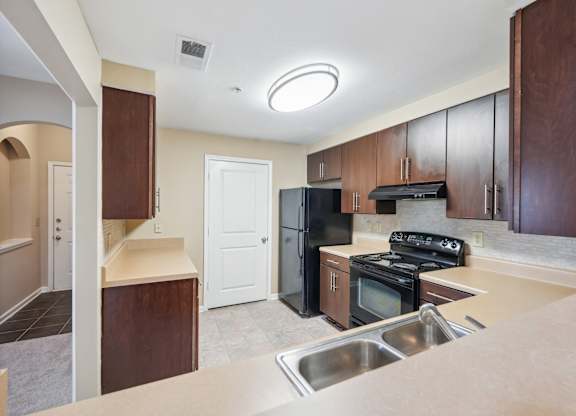 A kitchen with black appliances.
