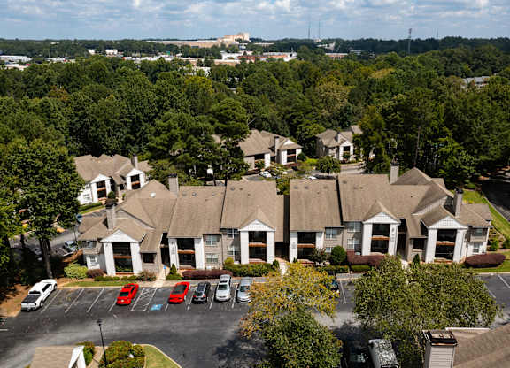 aerial view of apartment homes  with parking in front of it