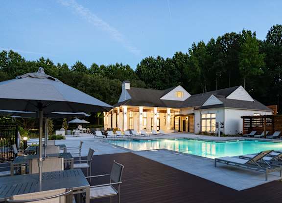 A large house with a pool in the backyard.