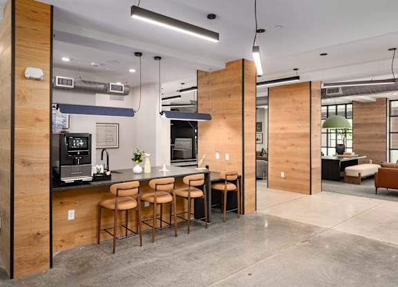 Leasing office with coffee machine and seats, perfect for touring