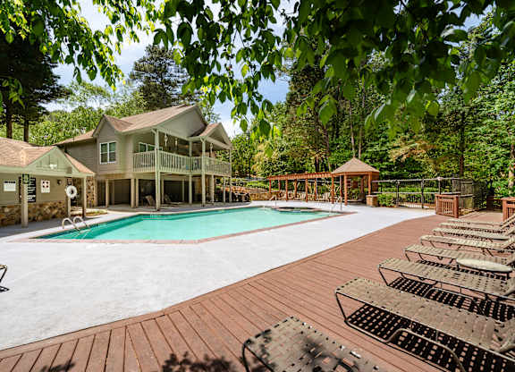 A large house with a pool in the backyard.